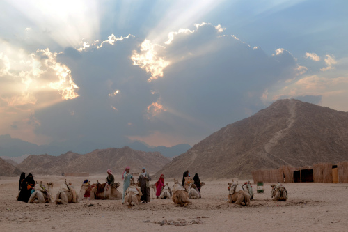 Bedouin people in the desert, just before the sun went down.