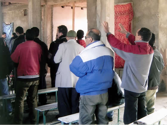 Algerians worshipping