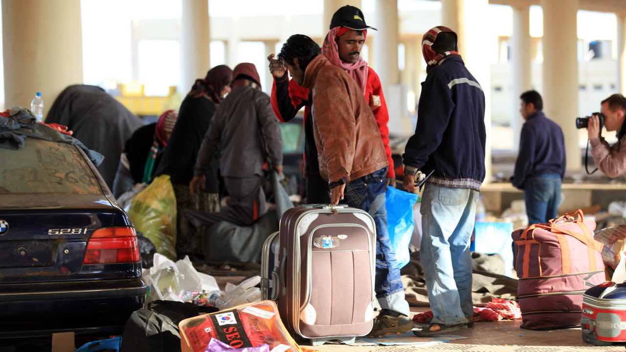 Refugee with suitcase